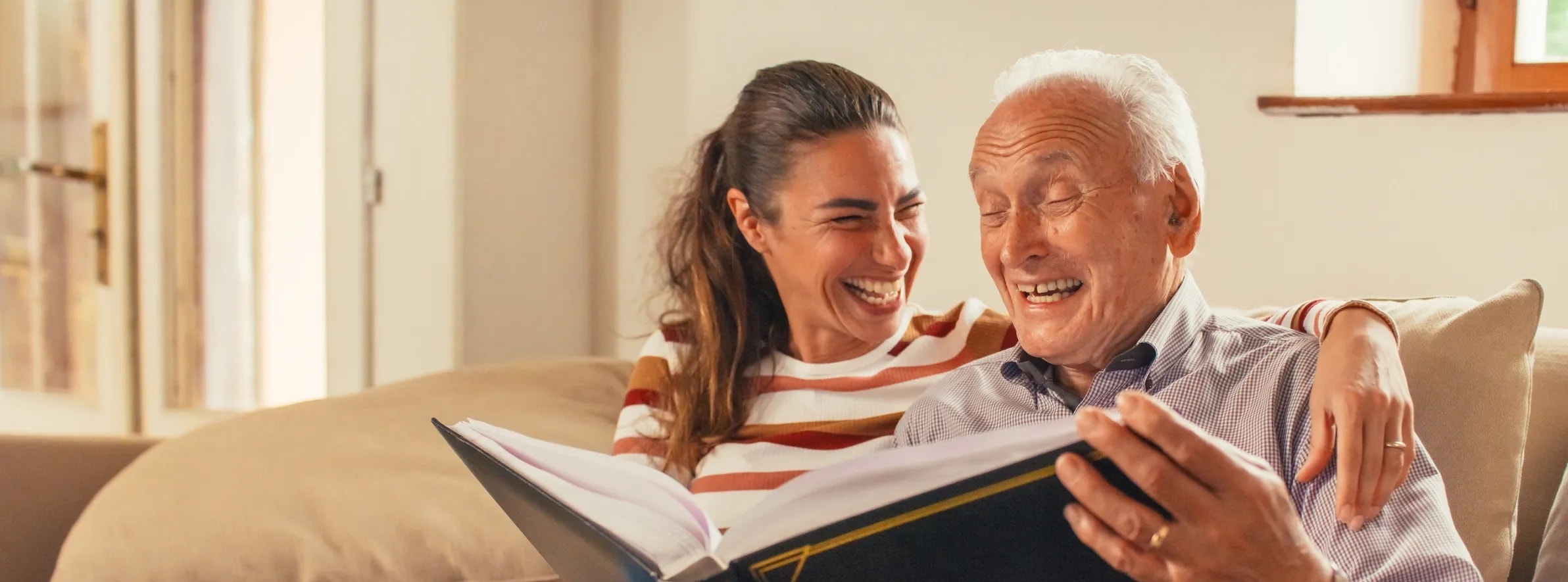 Family visiting a loved one in a warm home setting