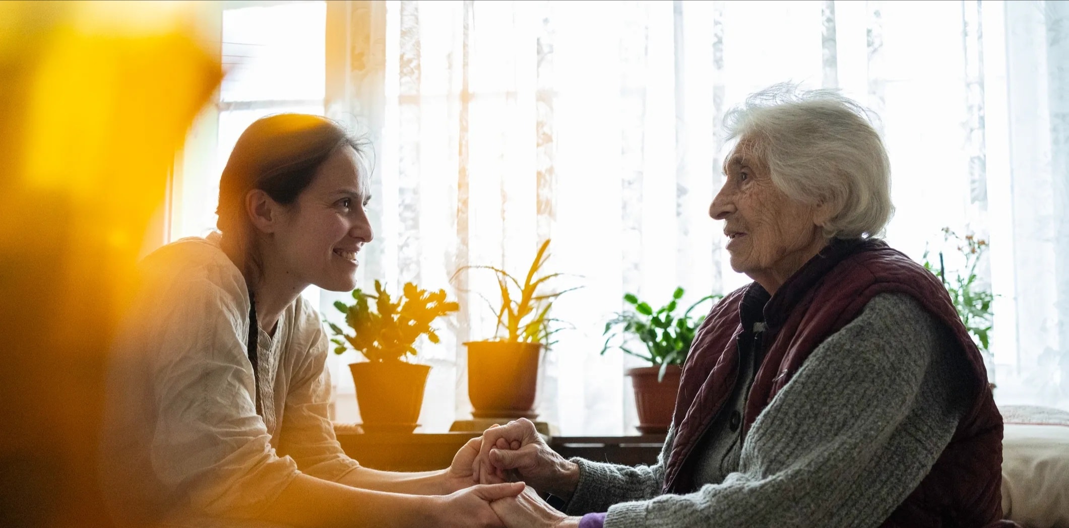 Compassionate caregiver supporting a senior resident