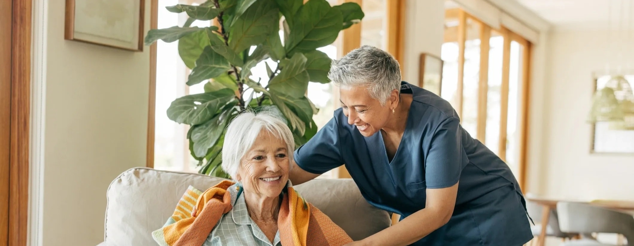 Caregiver providing attentive support to a senior resident